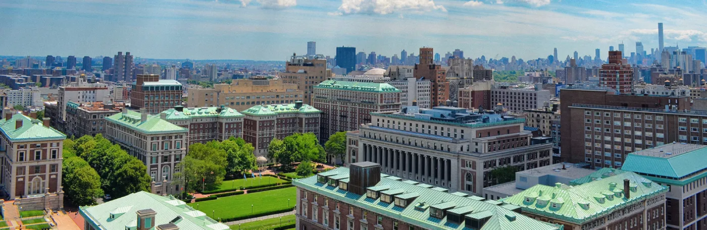 Aerial of the Columbia University Morningside campus with the New York City skyline in background